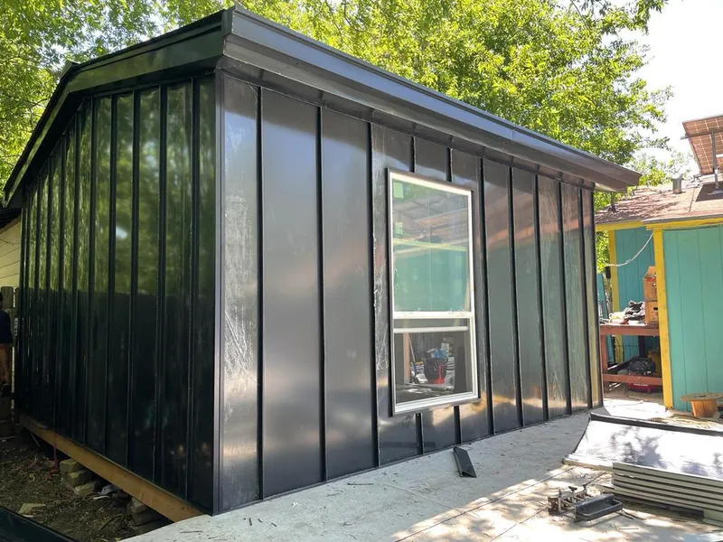 Black standing seam metal wall panels for Roof Inspection in Interlaken