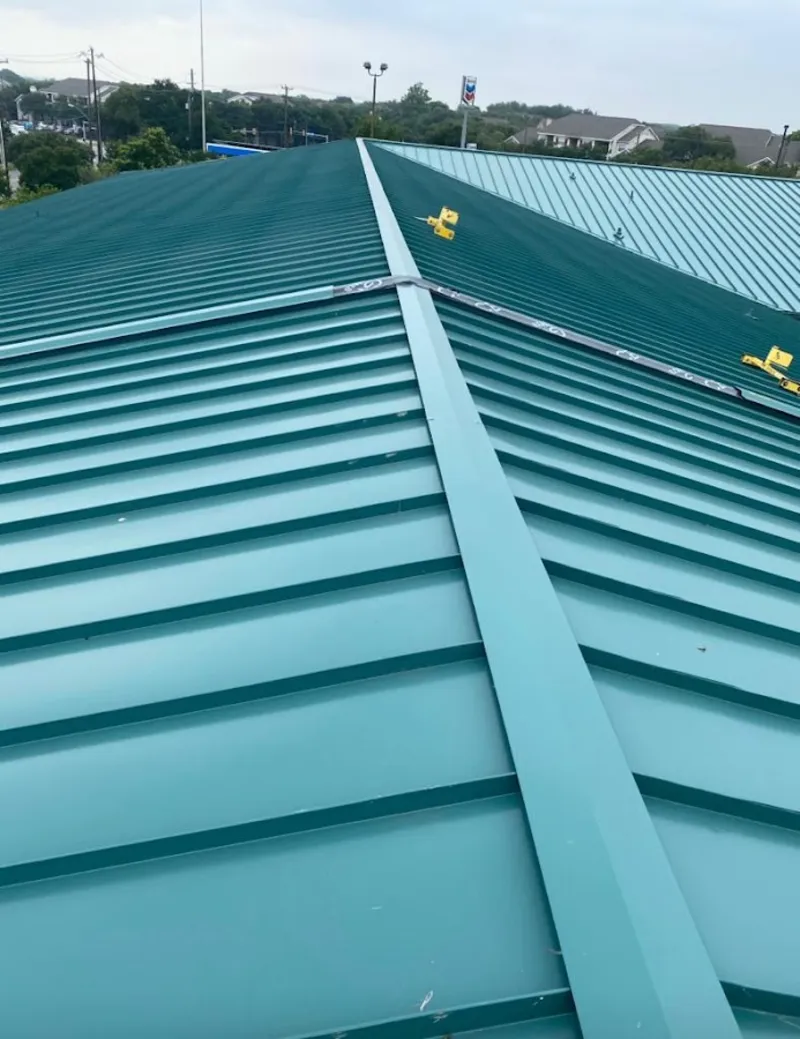 Green commercial metal roof ridge and valley for Metal Roof Repair in Interlaken
